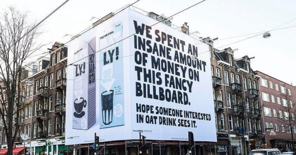 Oatly ad on a side of a building